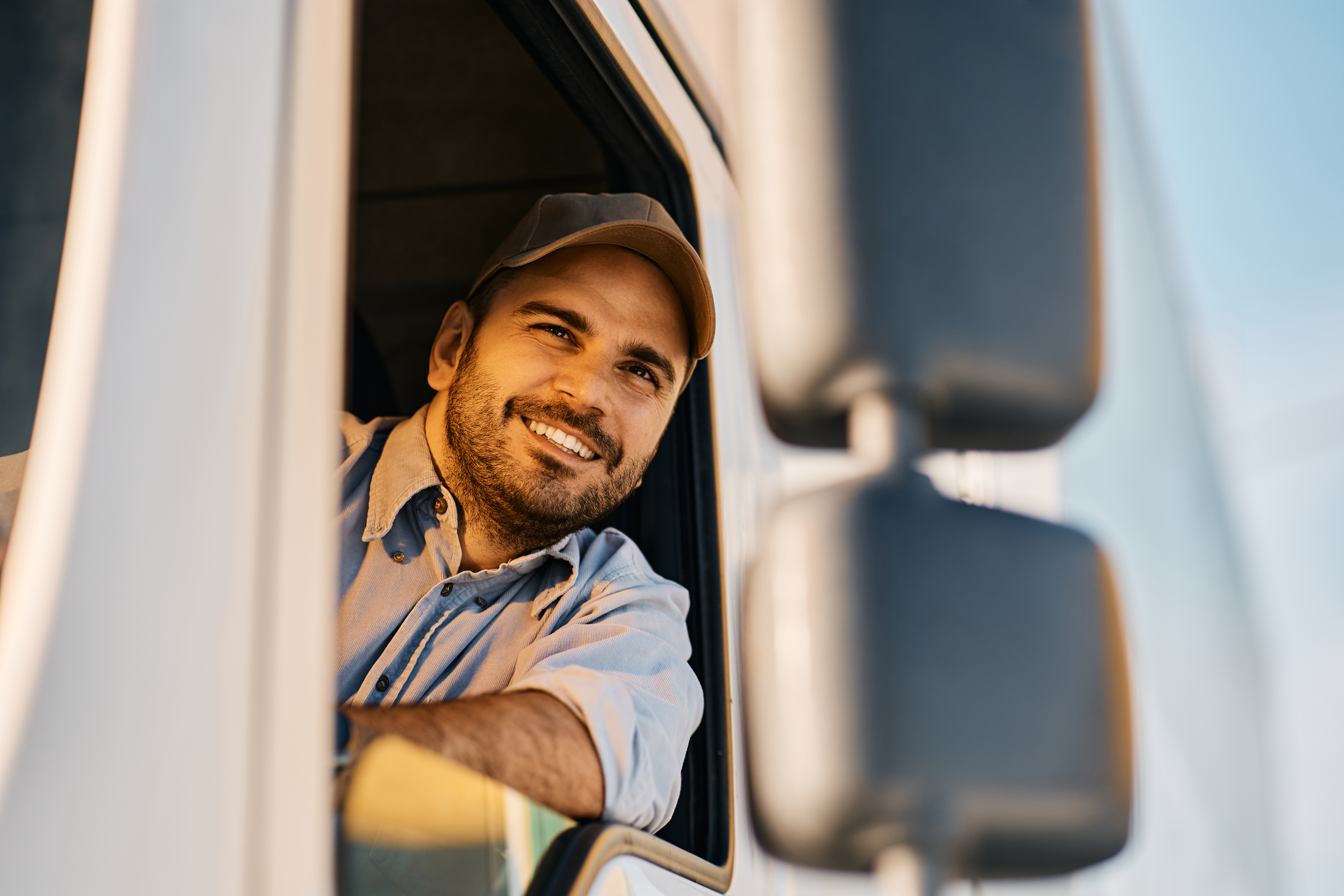 happy-truck-driver-looking-through-window-from-the-2022-11-29-22-44-05-utc